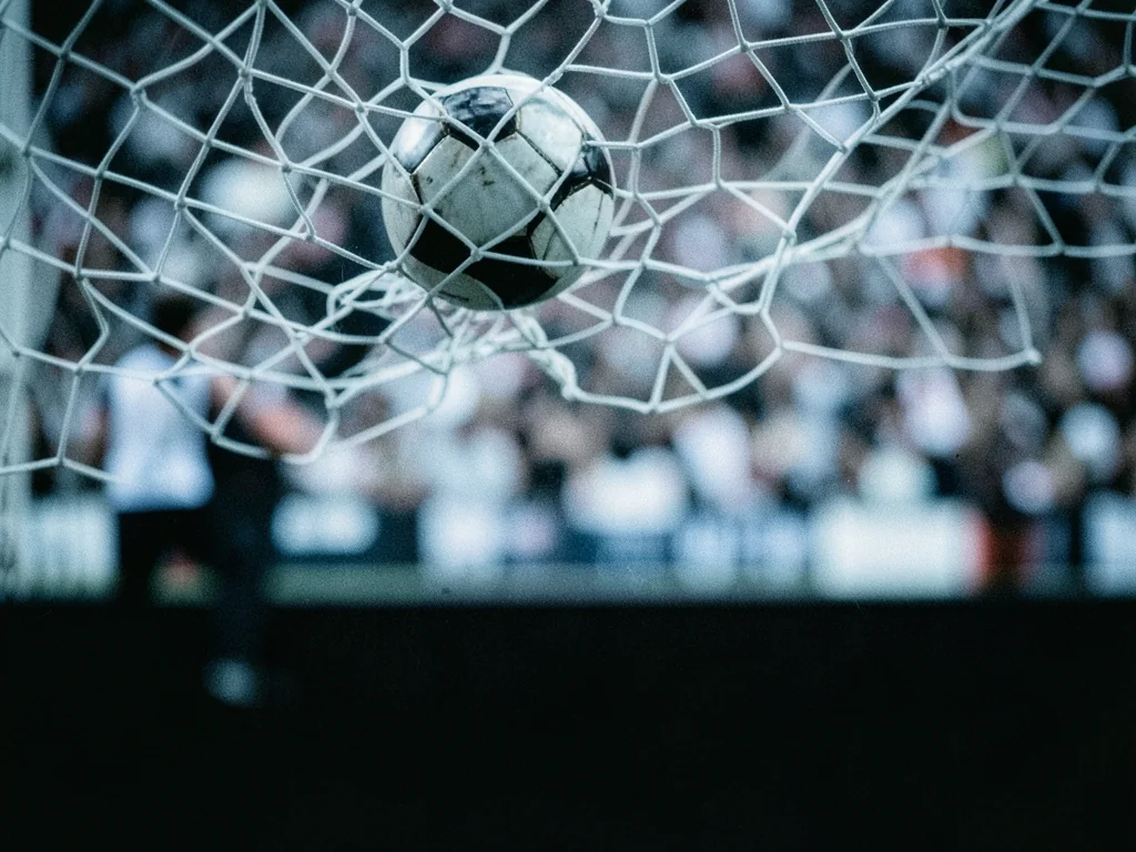 A ball hitting the back of the net